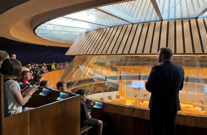 Kurtz welcomes Pembroke's Golden Grove School to the Senedd during a tour of the chamber
